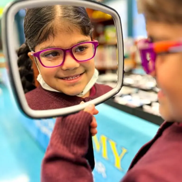 Optometrist examining a student